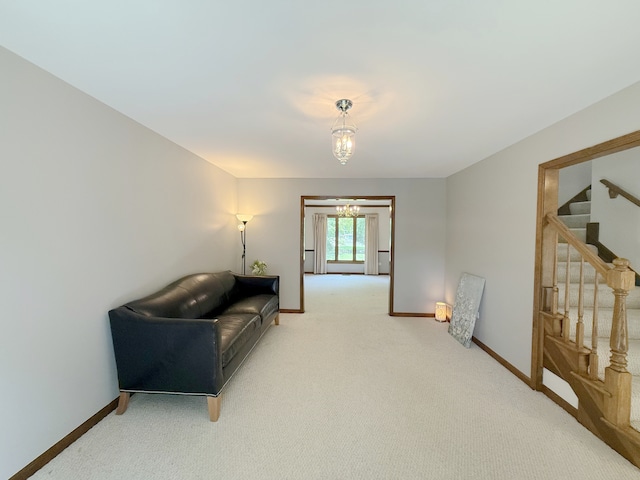 1463 Lantern Cir, Naperville, IL 60540 - sitting room featuring stairway, baseboards, carpet, and a chandelier