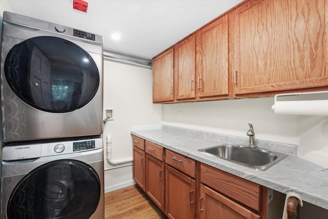 1051 Rockport Dr, Carol Stream, IL 60188 - laundry room with stacked washer and clothes dryer, cabinet space, and light wood-style flooring