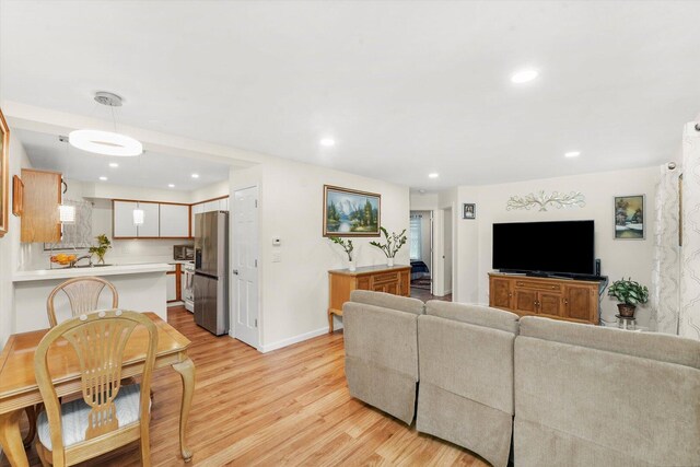 1051 Rockport Dr, Carol Stream, IL 60188 - living room with light wood-style floors, recessed lighting, and baseboards