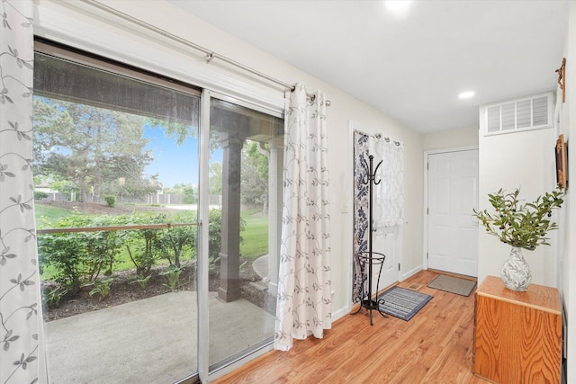 1051 Rockport Dr, Carol Stream, IL 60188 - doorway to outside featuring light wood finished floors, recessed lighting, and baseboards