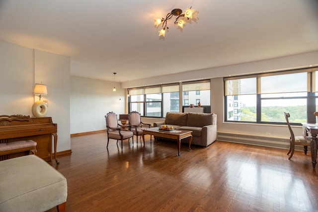 3410 N Lake Shore Dr Unit 9A, Chicago, IL 60657 - living room featuring baseboards, a baseboard heating unit, wood finished floors, and a chandelier