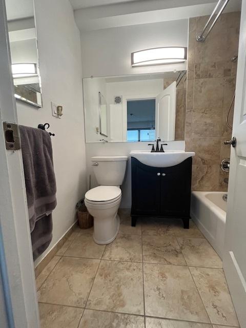 3410 N Lake Shore Dr Unit 9A, Chicago, IL 60657 - full bath with shower / bathtub combination, toilet, vanity, and tile patterned flooring