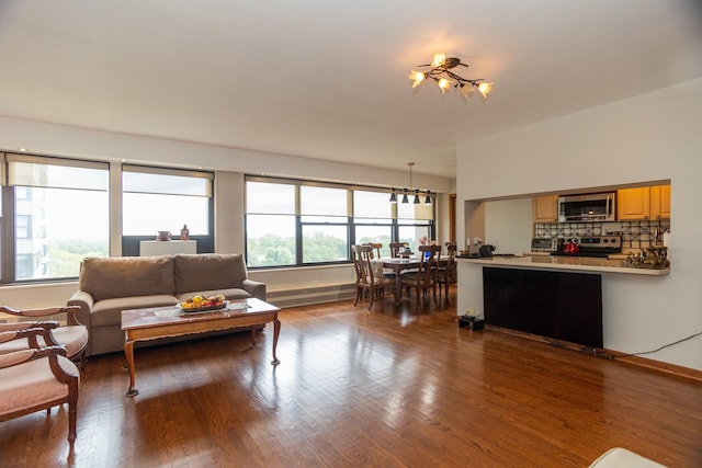 3410 N Lake Shore Dr Unit 9A, Chicago, IL 60657 - living area with plenty of natural light, wood finished floors, and baseboards