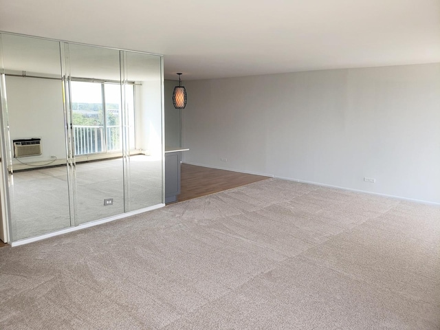 40 N Tower Rd Unit 5B, Oak Brook, IL 60523 - carpeted empty room with baseboards and a wall mounted AC