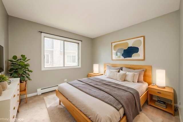 1315 N Baldwin Ct Unit 2C, Palatine, IL 60074 - bedroom featuring a baseboard heating unit, baseboards, and light colored carpet