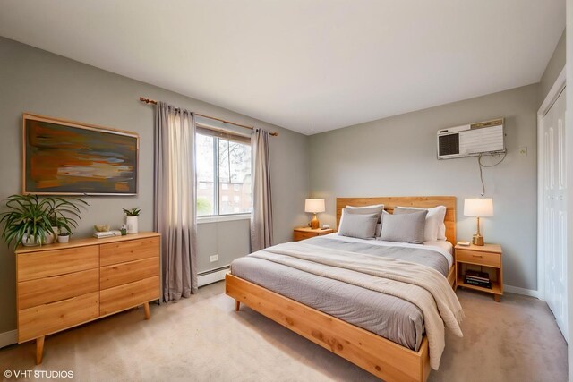 1315 N Baldwin Ct Unit 2C, Palatine, IL 60074 - bedroom featuring light colored carpet, a baseboard heating unit, a wall mounted AC, and baseboards