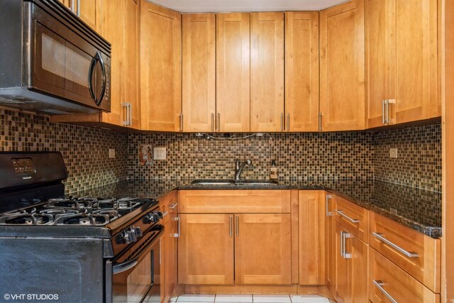 1315 N Baldwin Ct Unit 2C, Palatine, IL 60074 - kitchen featuring black appliances, a sink, dark stone countertops, tasteful backsplash, and brown cabinets