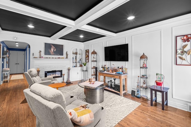 1844 N 77th Ct, Elmwood Park, IL 60707 - living room featuring crown molding, arched walkways, wood finished floors, coffered ceiling, and a decorative wall