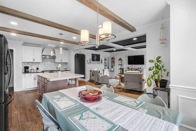 1844 N 77th Ct, Elmwood Park, IL 60707 - dining space with dark wood-style floors, beamed ceiling, arched walkways, crown molding, and a chandelier