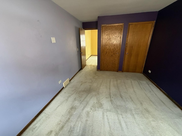 1235 S Mannheim Rd, Westchester, IL 60154 - unfurnished bedroom with carpet floors and two closets