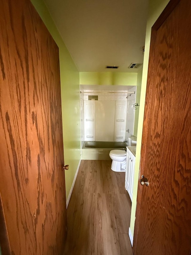 1235 S Mannheim Rd, Westchester, IL 60154 - full bathroom featuring wood finished floors, shower / tub combination, toilet, vanity, and baseboards