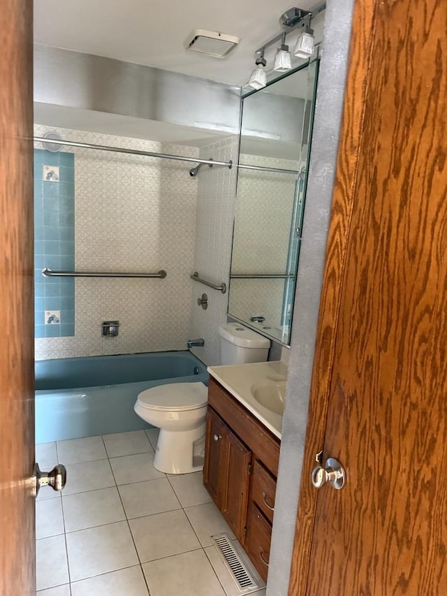 1235 S Mannheim Rd, Westchester, IL 60154 - bathroom featuring bathing tub / shower combination, vanity, tile patterned floors, and toilet