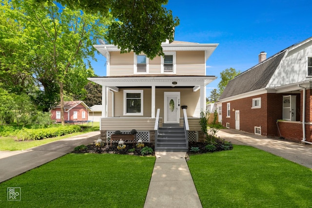712 Lebanon St, Aurora, IL 60505 - traditional style home with a porch and a front yard