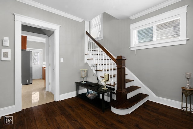 712 Lebanon St, Aurora, IL 60505 - stairway featuring baseboards, healthy amount of natural light, wood finished floors, and ornamental molding