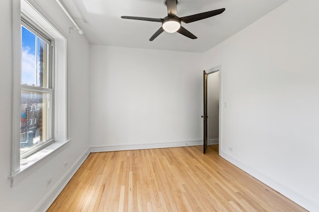 847 S Humphrey Ave Unit 3, Oak Park, IL 60304 - spare room with plenty of natural light, light wood-style floors, a ceiling fan, and baseboards