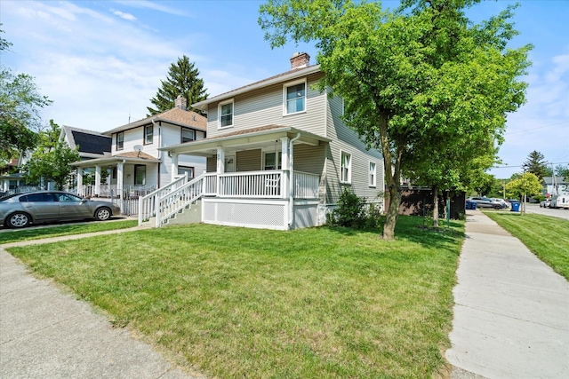 501 N 2nd Ave, Maywood, IL 60153 - american foursquare style home featuring a porch, a front yard, and a chimney