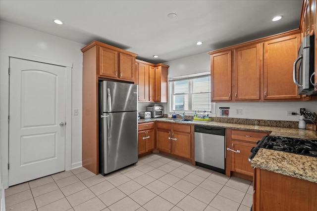 501 N 2nd Ave, Maywood, IL 60153 - kitchen with appliances with stainless steel finishes, brown cabinets, a sink, recessed lighting, and light tile patterned floors