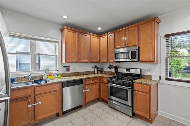 501 N 2nd Ave, Maywood, IL 60153 - kitchen featuring stainless steel appliances, brown cabinetry, and recessed lighting