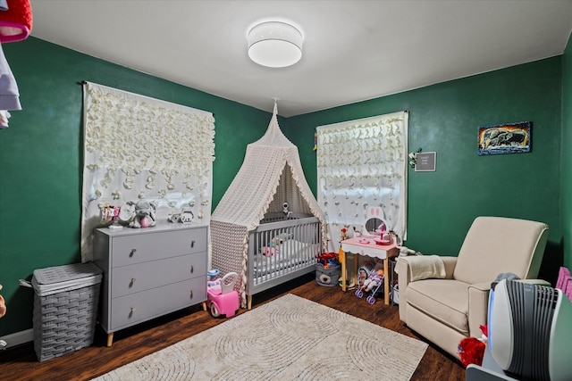 501 N 2nd Ave, Maywood, IL 60153 - bedroom with a crib and wood finished floors