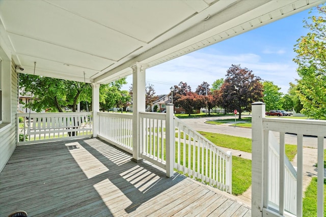 501 N 2nd Ave, Maywood, IL 60153 - wooden porch featuring a lawn