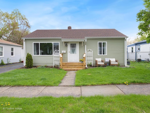 307 N Schubert St, Palatine, IL 60067 - view of front of home with a chimney and roof with shingles