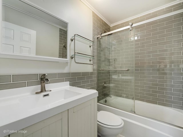 307 N Schubert St, Palatine, IL 60067 - full bath featuring toilet, enclosed tub / shower combo, vanity, ornamental molding, and tile walls