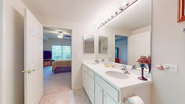 701 W Rand Rd Unit 227, Arlington Heights, IL 60004 - ensuite bathroom featuring double vanity, ceiling fan, tile patterned floors, and baseboards