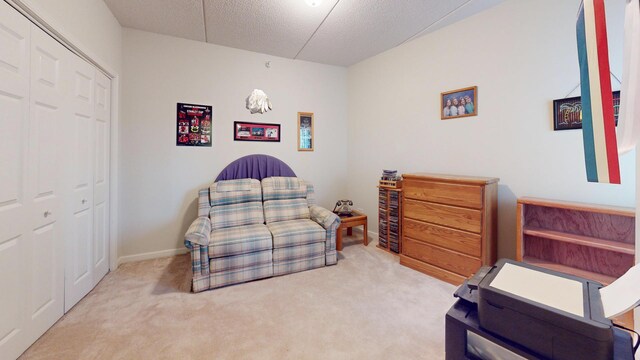 701 W Rand Rd Unit 227, Arlington Heights, IL 60004 - bedroom with carpet, a textured ceiling, a closet, and baseboards