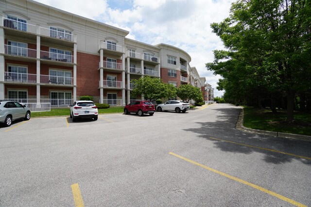 701 W Rand Rd Unit 227, Arlington Heights, IL 60004 - view of apartment building / complex with uncovered parking
