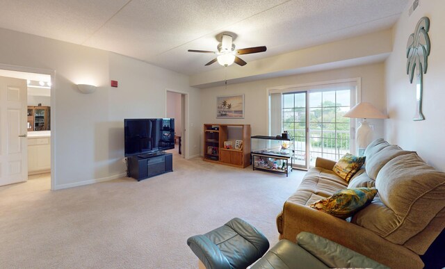 701 W Rand Rd Unit 227, Arlington Heights, IL 60004 - living room with light colored carpet, a ceiling fan, and baseboards