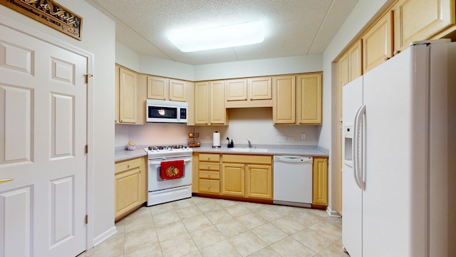 701 W Rand Rd Unit 227, Arlington Heights, IL 60004 - kitchen with white appliances, a sink, light countertops, light brown cabinetry, and a textured ceiling