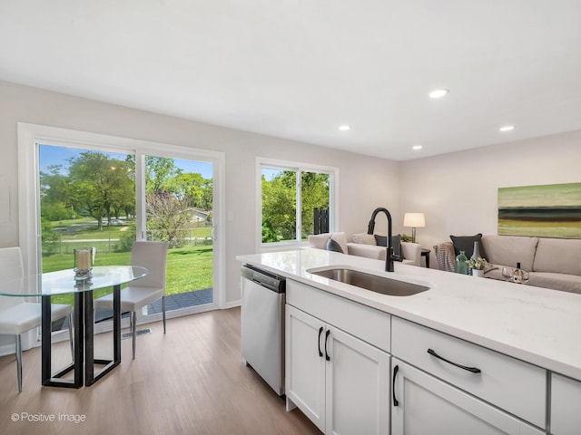 729 Bolton Way, Hanover Park, IL 60133 - kitchen with stainless steel dishwasher, a sink, wood finished floors, white cabinets, and recessed lighting