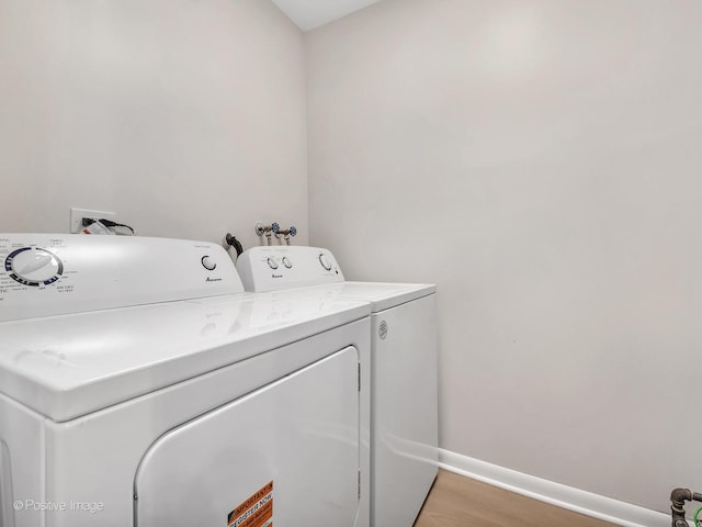 729 Bolton Way, Hanover Park, IL 60133 - laundry room featuring washer and dryer, baseboards, and light wood finished floors
