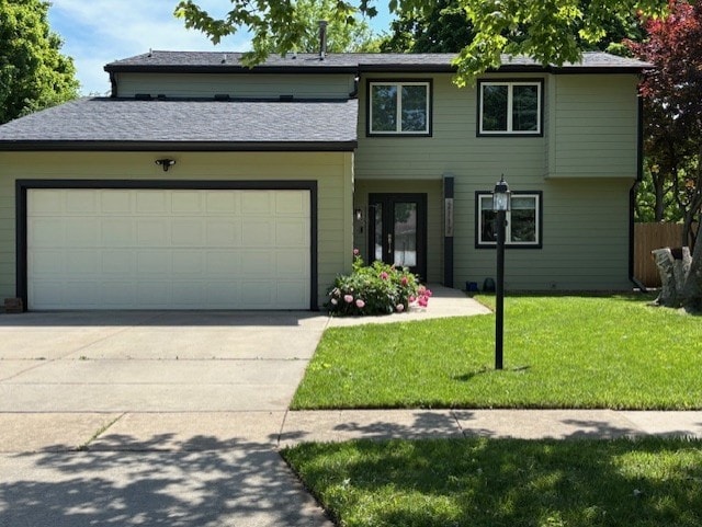 2112 Mayfair Rd, Champaign, IL 61821 - view of front of home with an attached garage and driveway