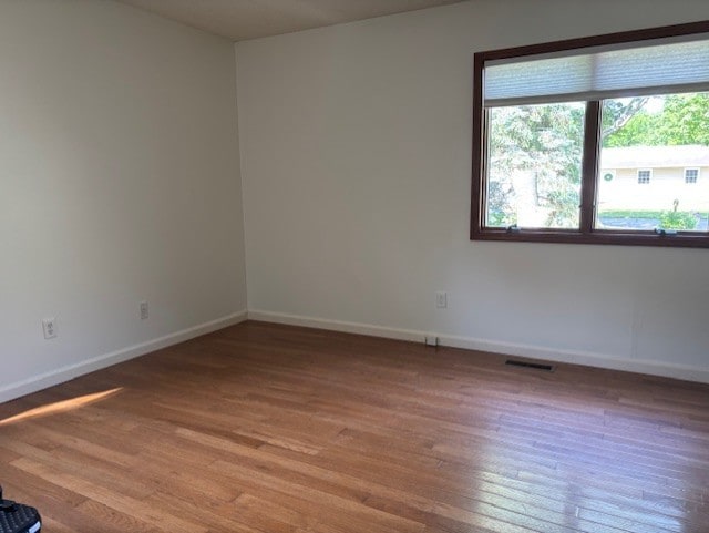 2112 Mayfair Rd, Champaign, IL 61821 - empty room featuring light wood-type flooring and baseboards
