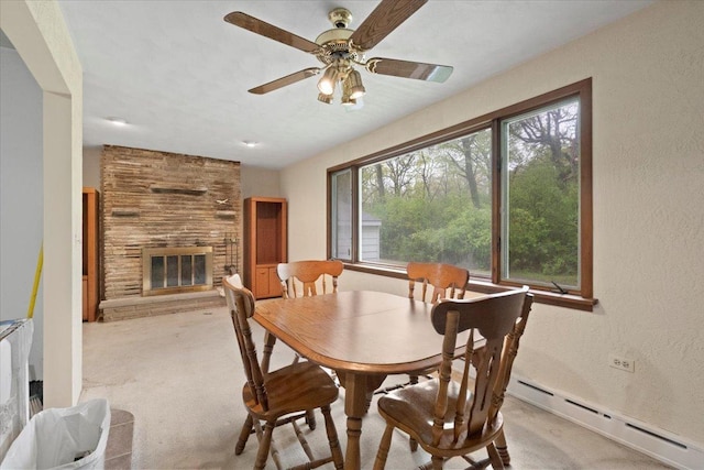 37519 N N Ave, Beach Park, IL 60087 - dining room with a baseboard radiator, light carpet, a large fireplace, and a ceiling fan