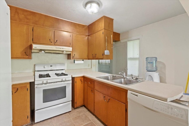 37519 N N Ave, Beach Park, IL 60087 - kitchen featuring under cabinet range hood, white appliances, a sink, and light countertops
