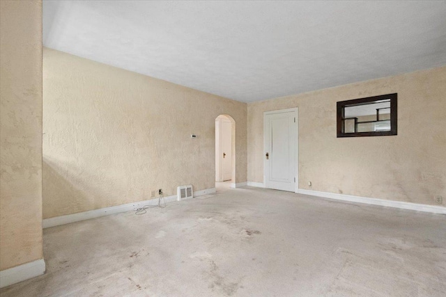 37519 N N Ave, Beach Park, IL 60087 - unfurnished room with arched walkways, unfinished concrete flooring, and baseboards