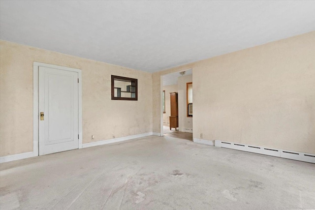 37519 N N Ave, Beach Park, IL 60087 - carpeted empty room featuring baseboards and a baseboard radiator