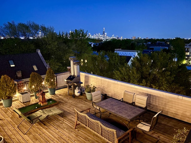 2207 N Western Ave Unit 2C, Chicago, IL 60647 - deck at twilight featuring outdoor dining area