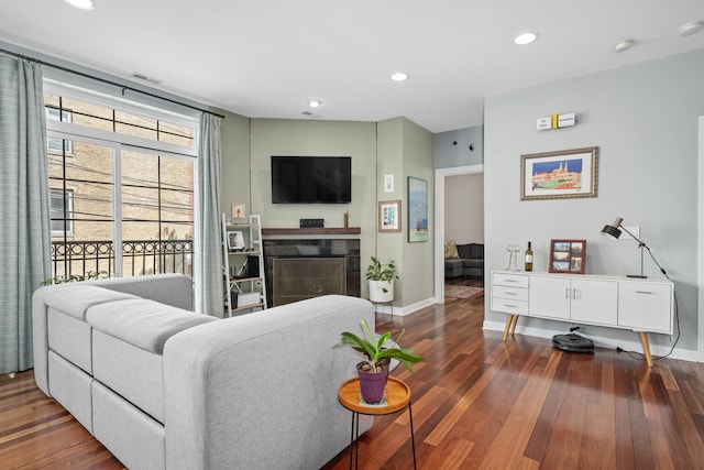 2207 N Western Ave Unit 2C, Chicago, IL 60647 - living area featuring dark wood finished floors, baseboards, recessed lighting, and a tile fireplace