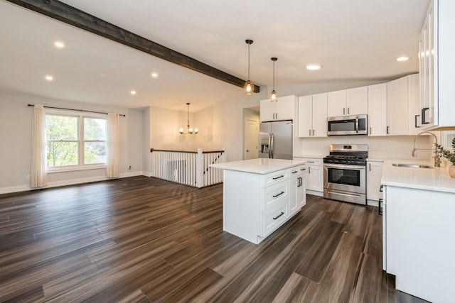 9104 Oriole Trl, Wonder Lake, IL 60097 - kitchen featuring appliances with stainless steel finishes, a sink, a chandelier, recessed lighting, and light countertops