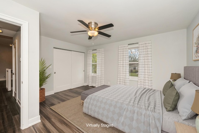 9104 Oriole Trl, Wonder Lake, IL 60097 - bedroom with dark wood-type flooring, a closet, baseboards, and ceiling fan