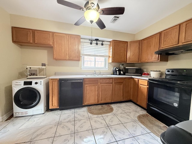 22633 Pleasant Dr Unit 11B, Richton Park, IL 60471 - kitchen featuring black appliances, under cabinet range hood, washer / dryer, a sink, and light countertops