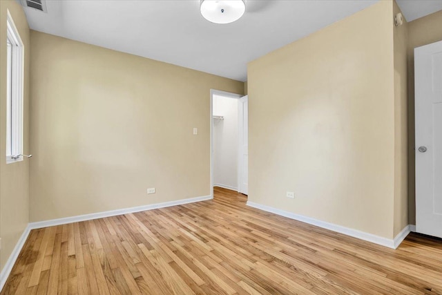 2425 W Riverside Dr, Mchenry, IL 60050 - unfurnished room with light wood-type flooring, baseboards, and a smoke detector