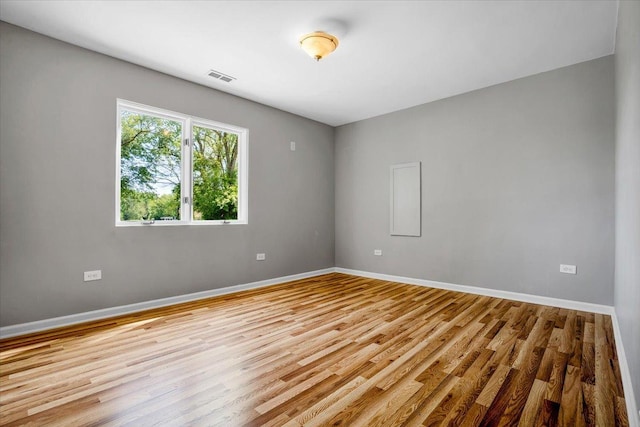 2425 W Riverside Dr, Mchenry, IL 60050 - unfurnished room featuring wood finished floors and baseboards