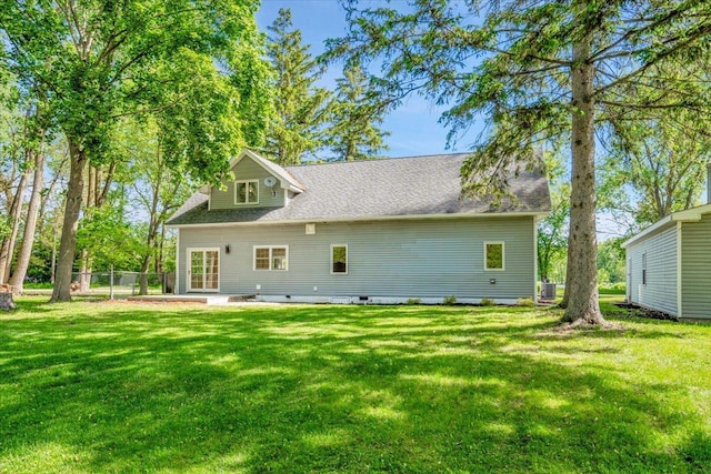 2425 W Riverside Dr, Mchenry, IL 60050 - back of property featuring central AC unit, a patio area, and roof with shingles