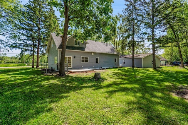 2425 W Riverside Dr, Mchenry, IL 60050 - rear view of property featuring a patio area and a lawn
