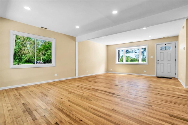 2425 W Riverside Dr, Mchenry, IL 60050 - spare room featuring light wood-style floors, baseboards, and recessed lighting