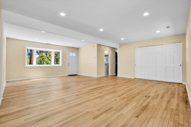 2425 W Riverside Dr, Mchenry, IL 60050 - unfurnished living room featuring light wood-style floors, recessed lighting, and baseboards